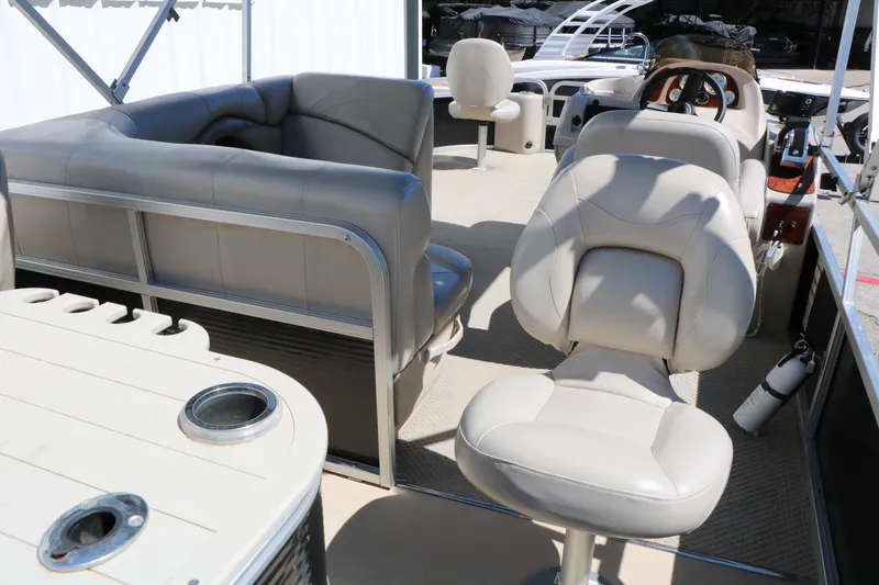 Slide: The Image of Interior of 2012 Starcraft Stardeck 206 4-PT boat with beige seating and table. - 23