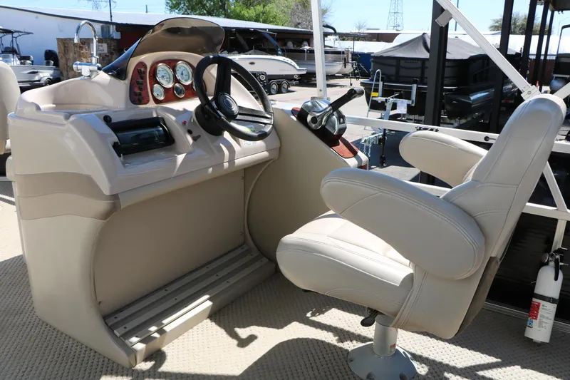 Slide: The Image of 2012 Starcraft Stardeck 206 4-PT boat helm with steering wheel and gauges. - 25