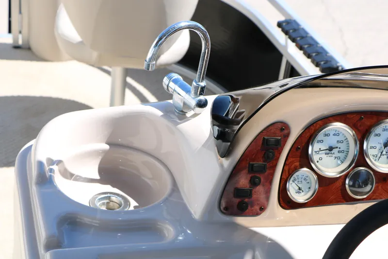 Slide: The Image of 2012 Starcraft Stardeck 206 4-PT boat dashboard with sink and gauges. - 27