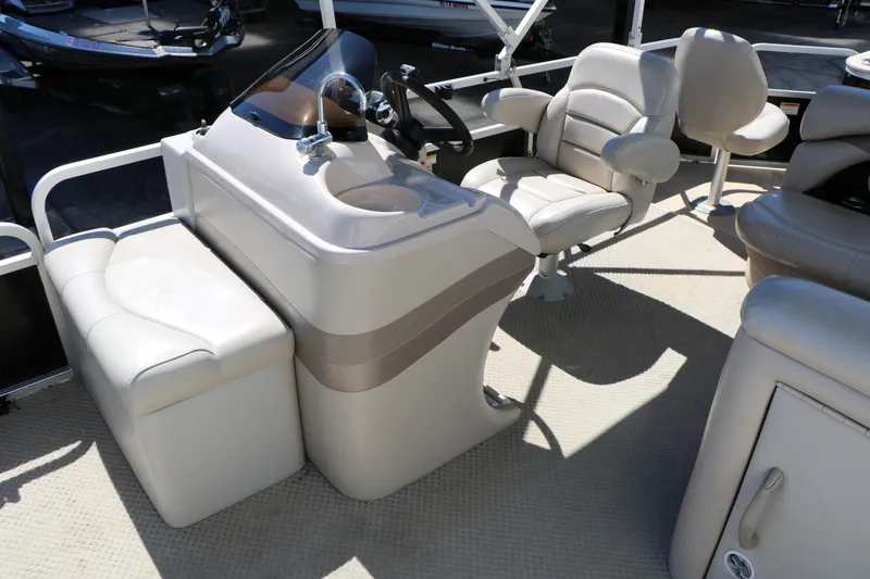 Slide: The Image of 2012 Starcraft Stardeck 206 4-PT boat interior with helm and seating area. - 30