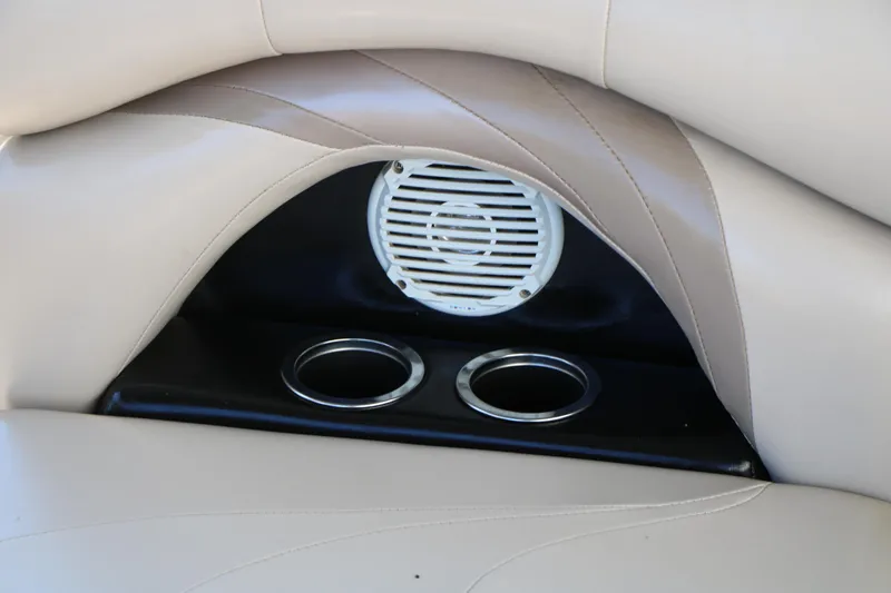 Slide: The Image of 2012 Starcraft Stardeck 206 4-PT boat interior with speaker and cup holders. - 34