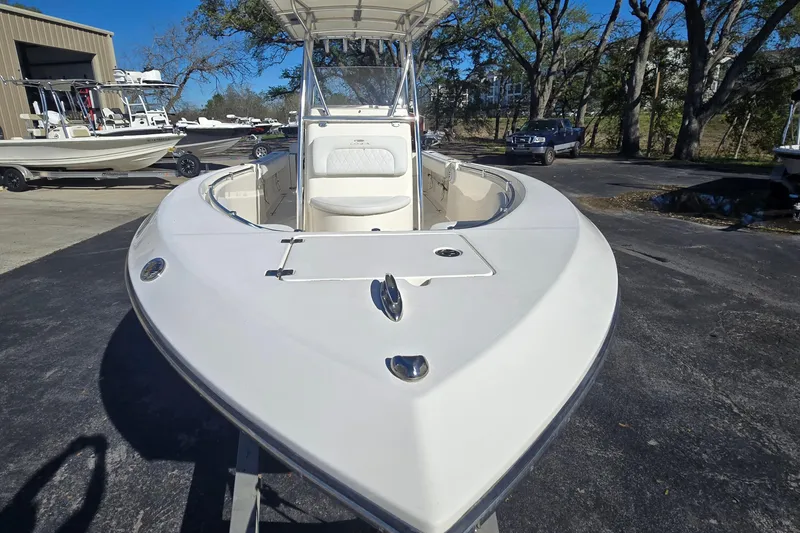 Slide: The Image of 2022 Cobia 237 Center Console boat in outdoor showroom, front view. - 11