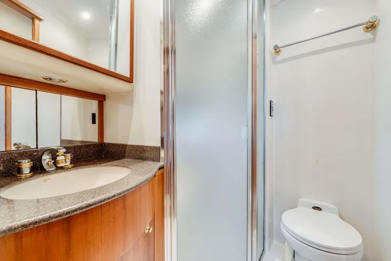 Slide: The Image of Luxurious bathroom in 1998 Bayliner 5788 Pilot House Motoryacht with modern fixtures and shower. - 109