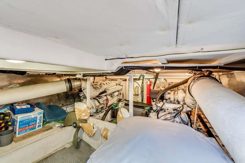 Slide: The Image of Engine room of 1998 Bayliner 5788 Pilot House Motoryacht, showcasing mechanical components. - 117