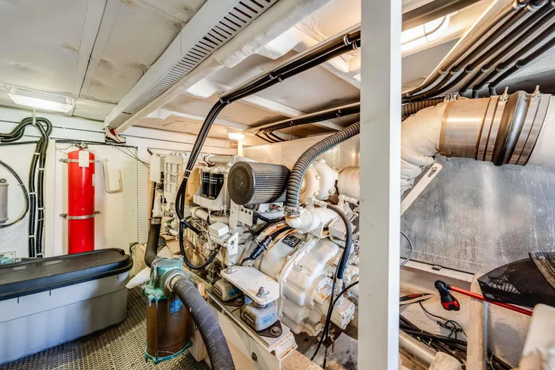 Slide: The Image of Engine room of 1998 Bayliner 5788 Pilot House Motoryacht with visible machinery and equipment. - 119