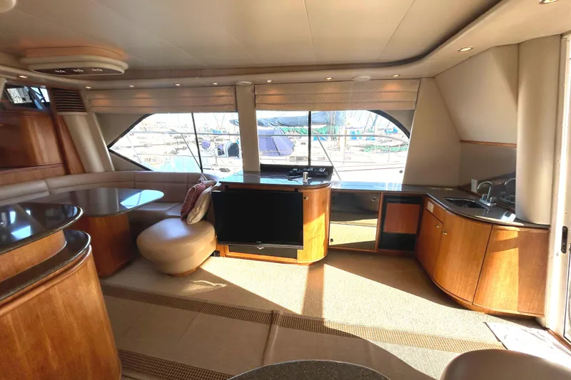 Slide: The Image of Interior of 1998 Bayliner 5788 Pilot House Motoryacht with TV and kitchenette. - 12