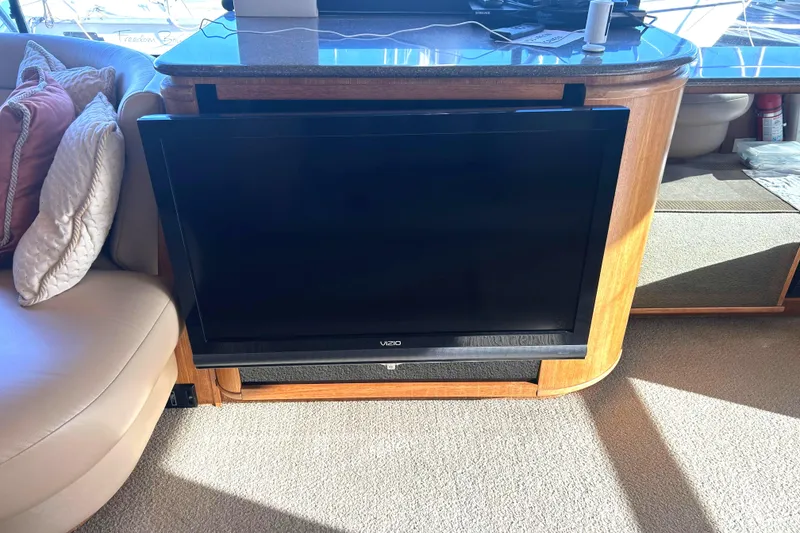 Slide: The Image of 1998 Bayliner 5788 Pilot House Motoryacht audio system with JVC components and wooden cabinetry. - 15