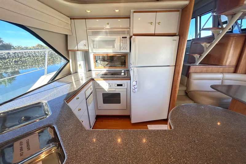 Slide: The Image of Luxurious kitchen interior of 1998 Bayliner 5788 Pilot House Motoryacht with modern appliances. - 22
