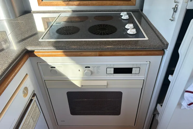 Slide: The Image of Built-in microwave in 1998 Bayliner 5788 Pilot House Motoryacht kitchen. - 26