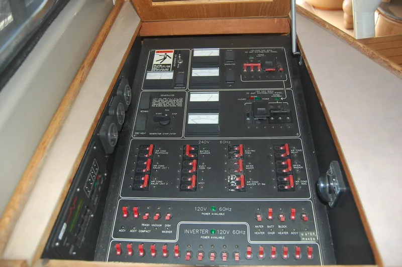 Slide: The Image of Electrical control panel of 1998 Bayliner 5788 Pilot House Motoryacht with gauges and switches. - 39