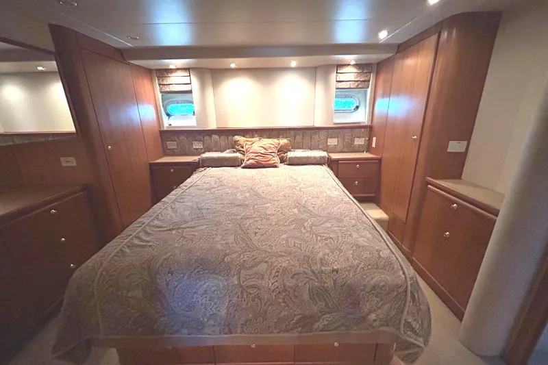 Slide: The Image of Luxurious Stateroom interior of 1998 Bayliner 5788 Pilot House Motoryacht with elegant wood finish. - 43