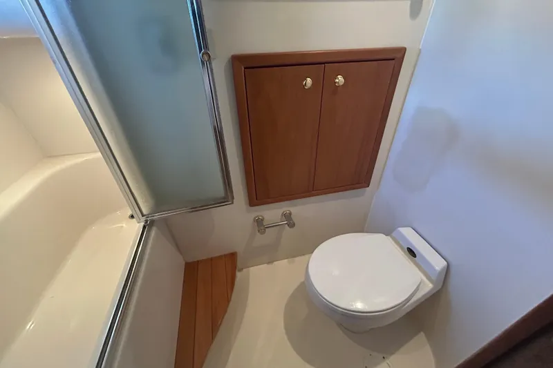Slide: The Image of Bathroom of 1998 Bayliner 5788 Pilot House Motoryacht with shower and window. - 53
