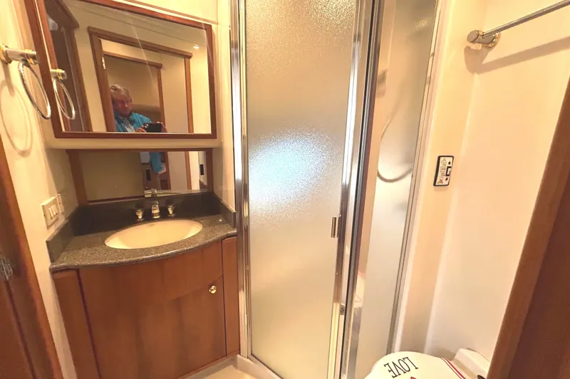 Slide: The Image of Guest head interior of 1998 Bayliner 5788 Pilot House Motoryacht with shower and vanity. - 59
