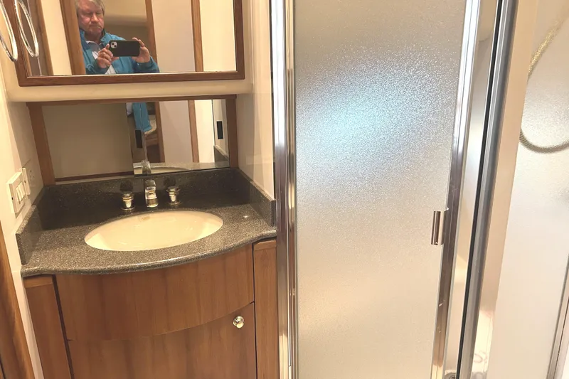 Slide: The Image of 1998 Bayliner 5788 Pilot House Motoryacht 3rd cabin with bunk beds and porthole window. - 63