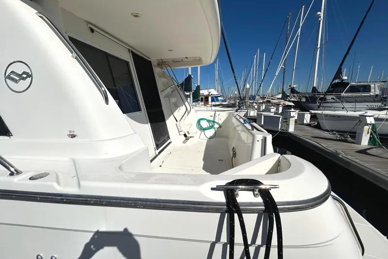 Slide: The Image of Engine room of 1998 Bayliner 5788 Pilot House Motoryacht, featuring dual engines and equipment. - 69