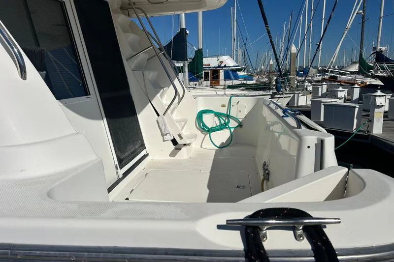 Slide: The Image of Engine room of 1998 Bayliner 5788 Pilot House Motoryacht, featuring dual engines and equipment. - 70