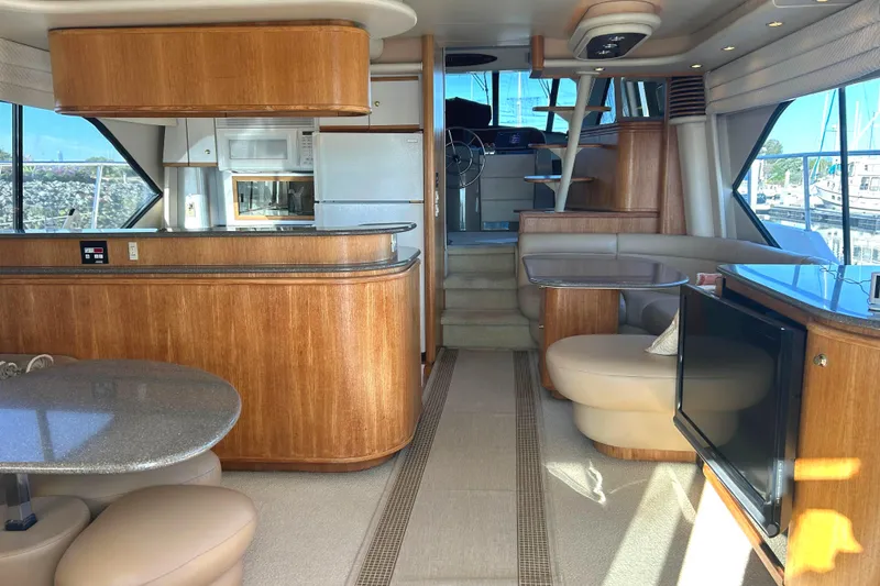 Slide: The Image of Luxurious interior of a 1998 Bayliner 5788 Pilot House Motoryacht with modern amenities. - 8