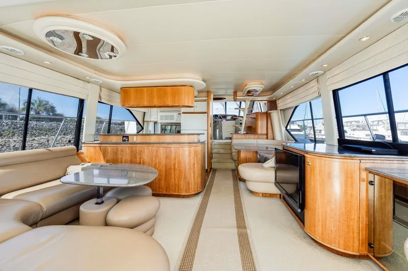 Slide: The Image of Luxurious interior of 1998 Bayliner 5788 Pilot House Motoryacht with elegant wood finishes. - 86