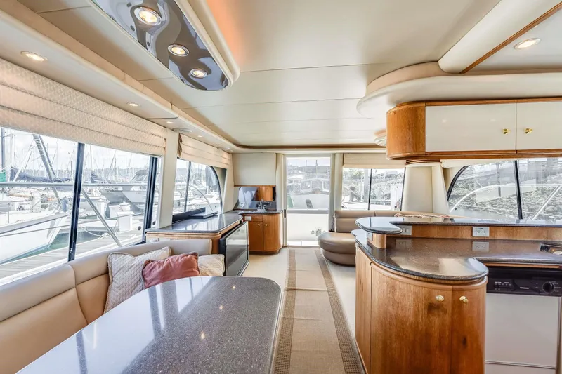 Slide: The Image of Luxurious interior of a 1998 Bayliner 5788 Pilot House Motoryacht with modern furnishings. - 87