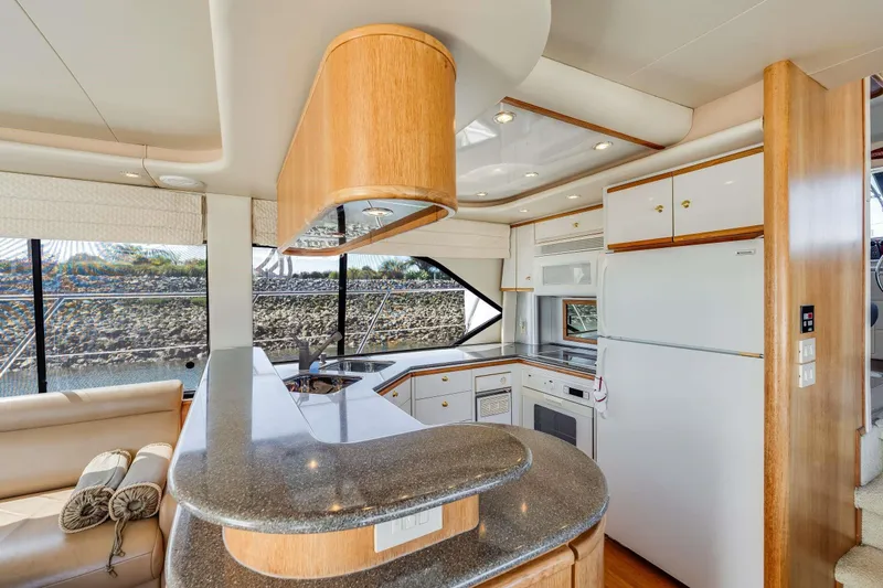 Slide: The Image of Luxurious kitchen interior of 1998 Bayliner 5788 Pilot House Motoryacht with modern amenities. - 93
