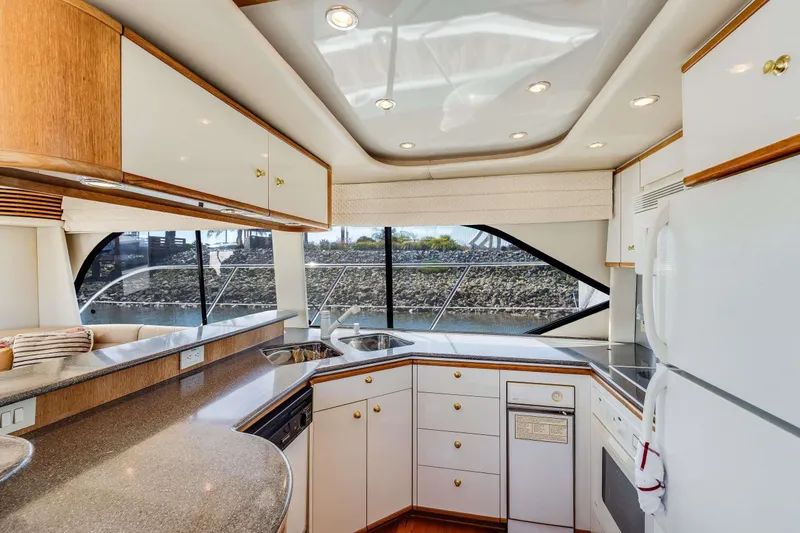 Slide: The Image of Luxurious kitchen interior of 1998 Bayliner 5788 Pilot House Motoryacht with modern amenities. - 94