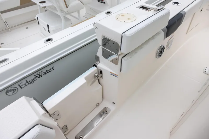Slide: The Image of 2021 Robalo R272 Center Console boat interior with seating and storage. - 10
