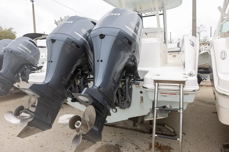 Slide: The Image of 2021 Robalo R272 Center Console with twin Yamaha outboard engines. - 2