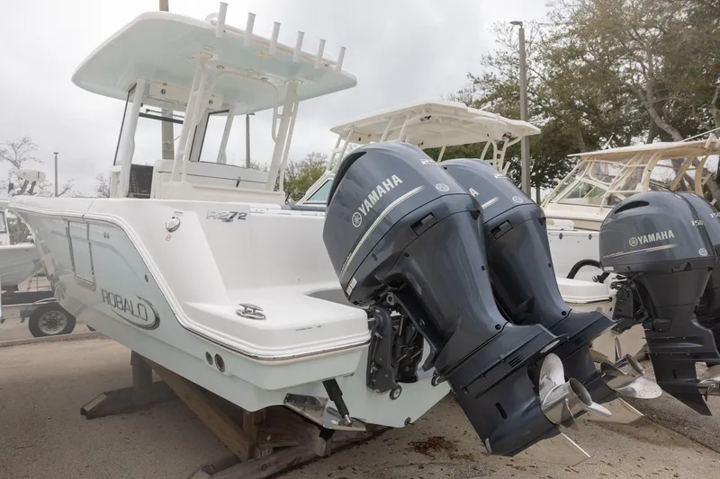 Slide: The Image of 2021 Robalo R272 Center Console boat with dual Yamaha outboard engines. - 3