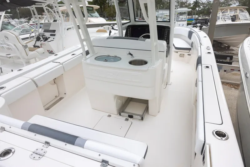 Slide: The Image of 2021 Robalo R272 Center Console boat interior with seating and console features. - 4