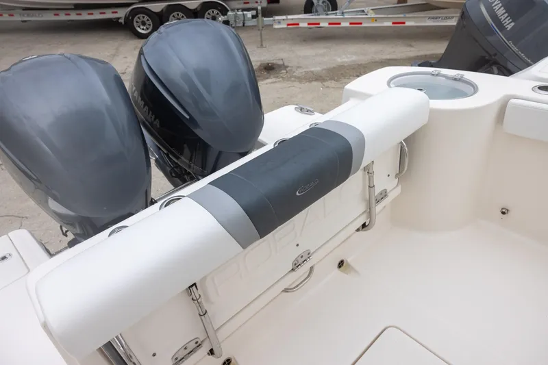 Slide: The Image of 2021 Robalo R272 Center Console boat with dual Yamaha engines, rear seating area. - 7