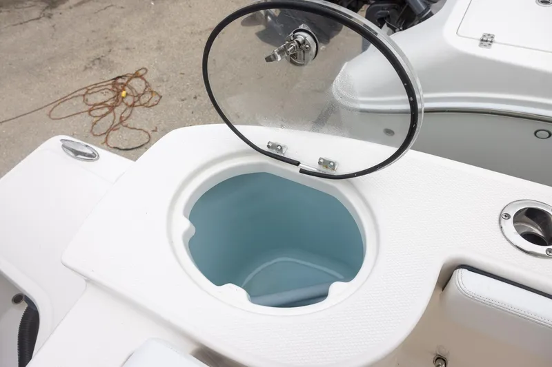 Slide: The Image of 2021 Robalo R272 Center Console boat livewell with open lid. - 8