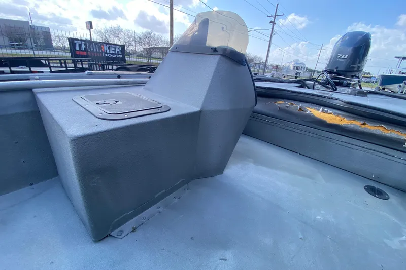 Slide: The Image of 1996 War Eagle 761 Renegade boat interior with console and damaged upholstery. - 13
