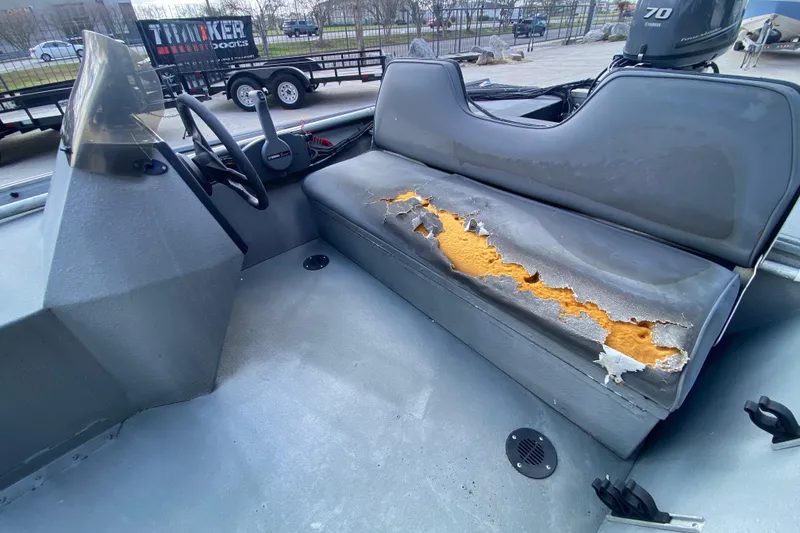 Slide: The Image of 1996 War Eagle 761 Renegade boat interior with damaged seat upholstery. - 16