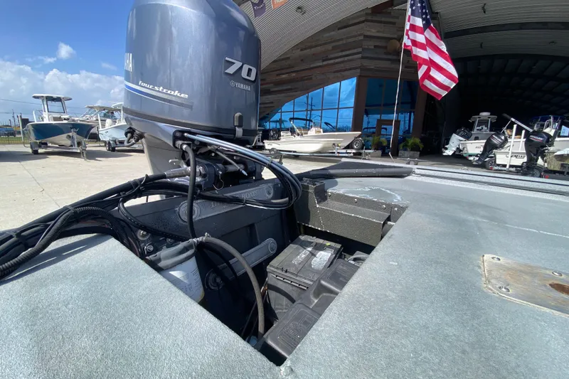 Slide: The Image of 1996 War Eagle 761 Renegade boat with Yamaha 70 four-stroke engine at marina. - 19