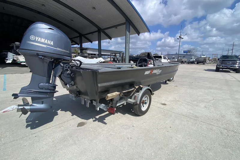 Slide: The Image of 1996 War Eagle 761 Renegade boat with Yamaha outboard motor on trailer. - 3