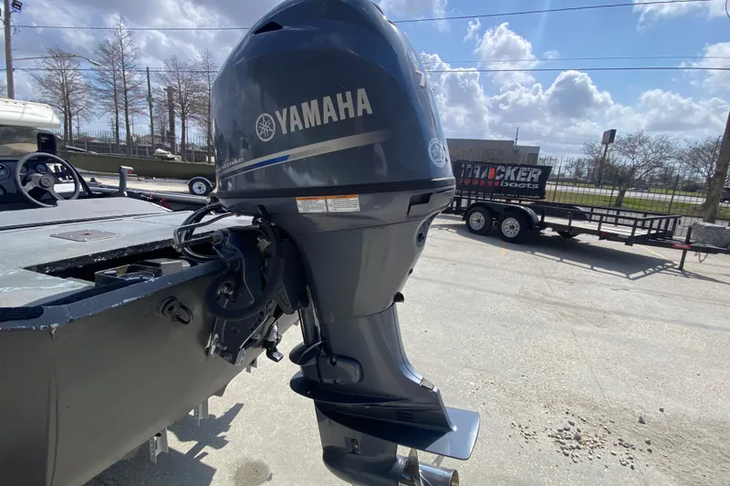 Slide: The Image of 1996 War Eagle 761 Renegade boat with Yamaha outboard motor in a sunny outdoor setting. - 6