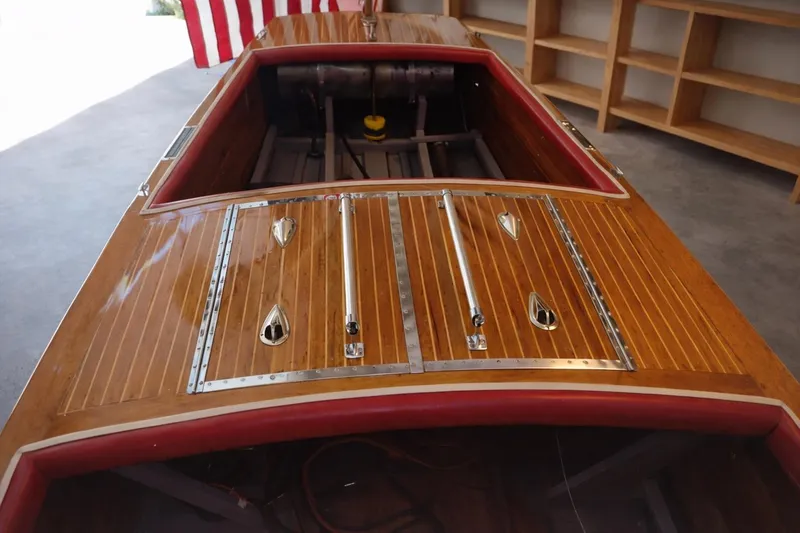 Slide: The Image of 1931 Dodge 16' Sea Nymph wooden boat with polished deck and American flag. - 11