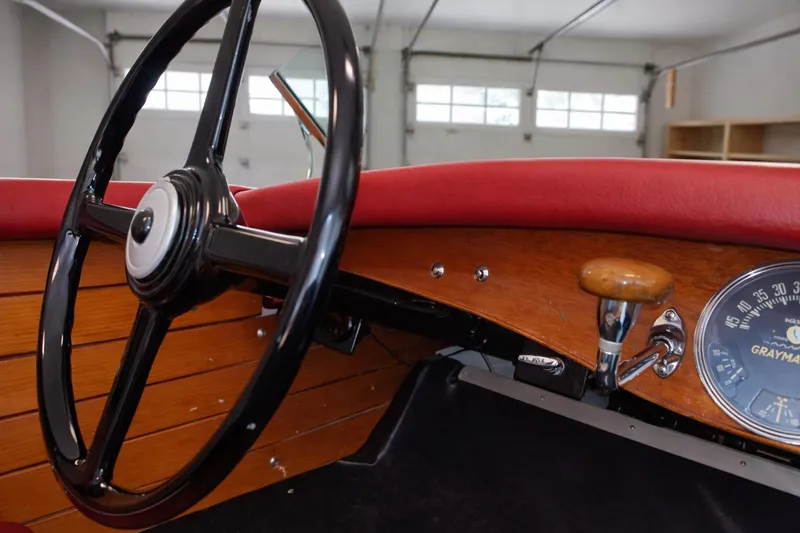 Slide: The Image of Interior of a 1931 Dodge 16' Sea Nymph boat with vintage steering wheel. - 12