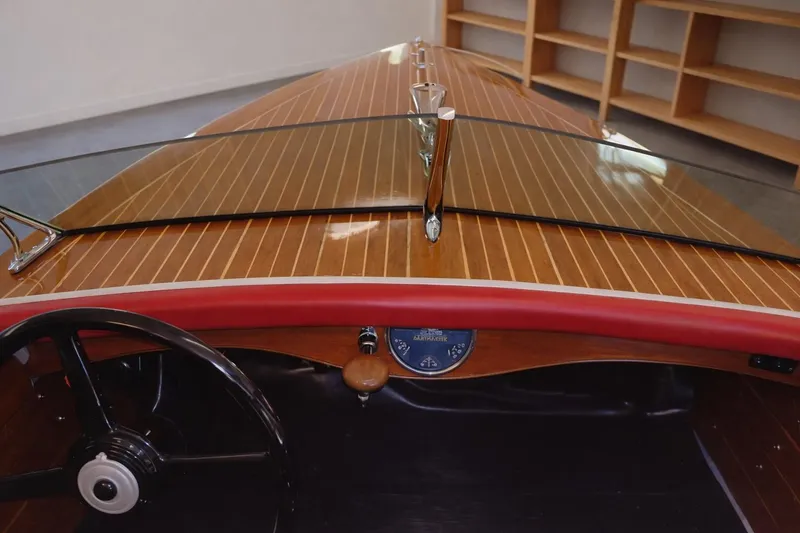Slide: The Image of 1931 Dodge 16' Sea Nymph boat interior with wooden dashboard and steering wheel. - 13
