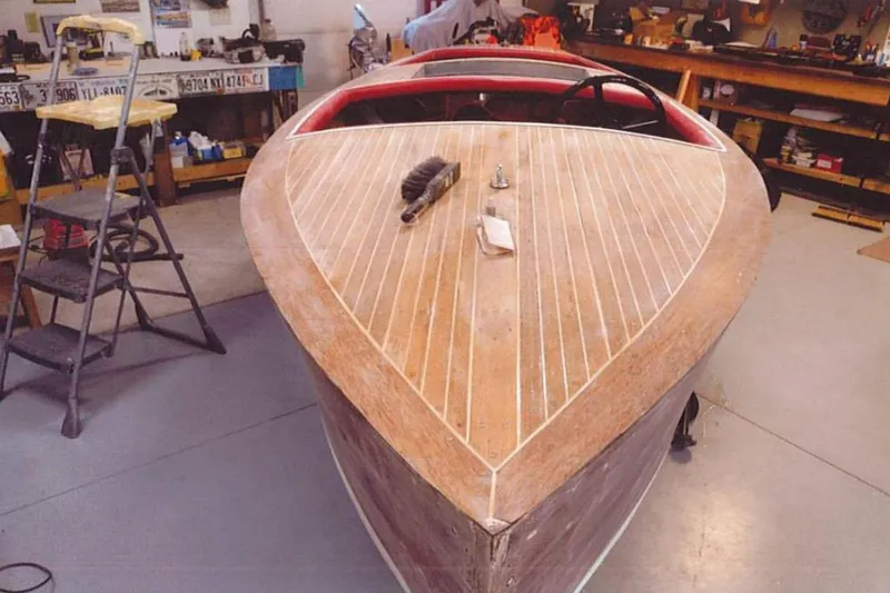 Slide: The Image of 1931 Dodge 16' Sea Nymph boat under restoration in workshop setting. - 17