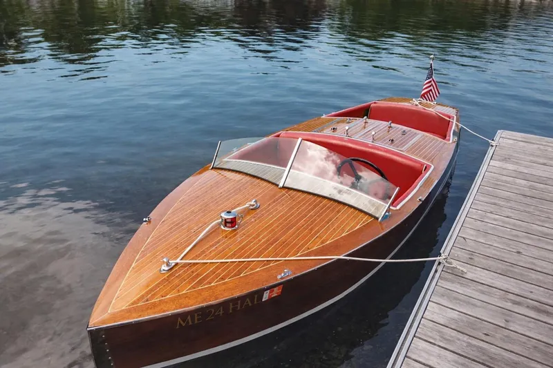 Slide: The Image of Vintage 1931 Dodge 16' Sea Nymph wooden boat docked on calm water. - 4