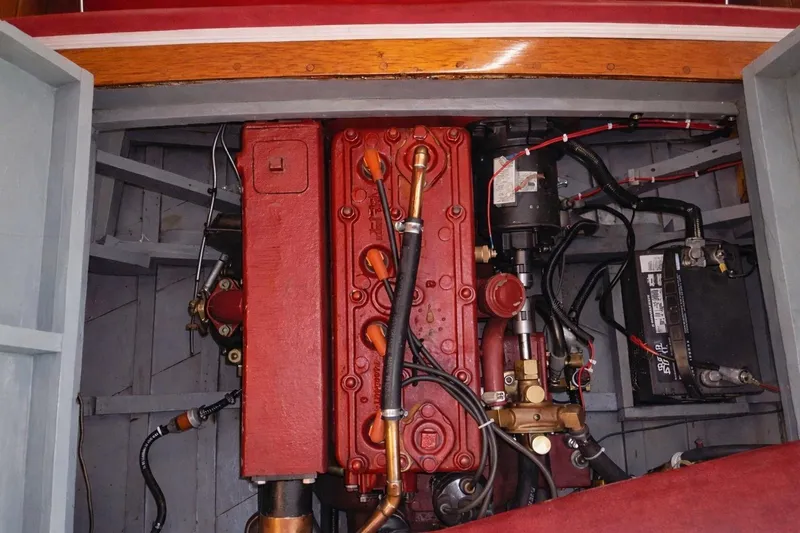 Slide: The Image of Engine compartment of a 1931 Dodge 16' Sea Nymph boat, showcasing vintage mechanics. - 9