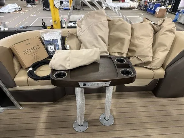 Slide: The Image of Interior of Godfrey Pontoons Sweetwater 2286 SB 2026 with table and covers. - 11