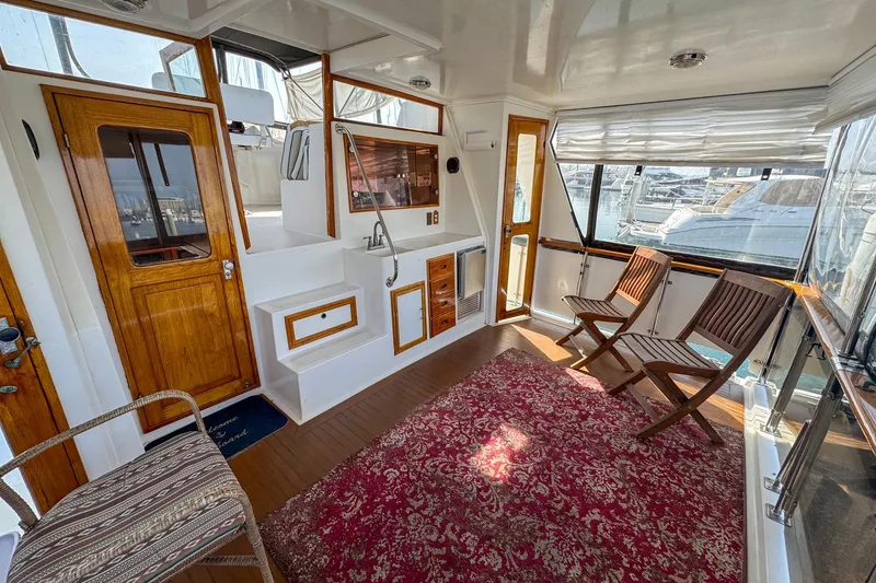 Slide: The Image of Interior of 1987 Lien Hwa 47 Elegant MK III yacht with wooden accents and seating area. - 10