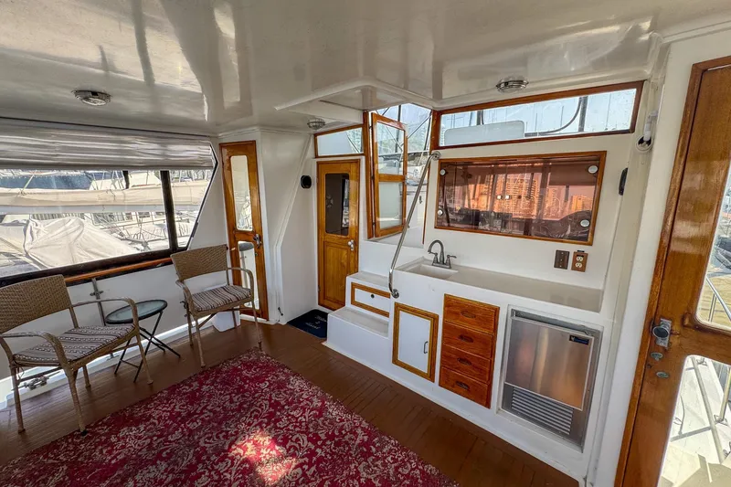 Slide: The Image of Interior of 1987 Lien Hwa 47 Elegant MK III yacht with seating and kitchenette. - 12
