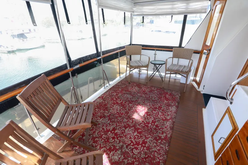 Slide: The Image of 1987 Lien Hwa 47 Elegant MK III yacht interior with chairs and red patterned rug. - 13