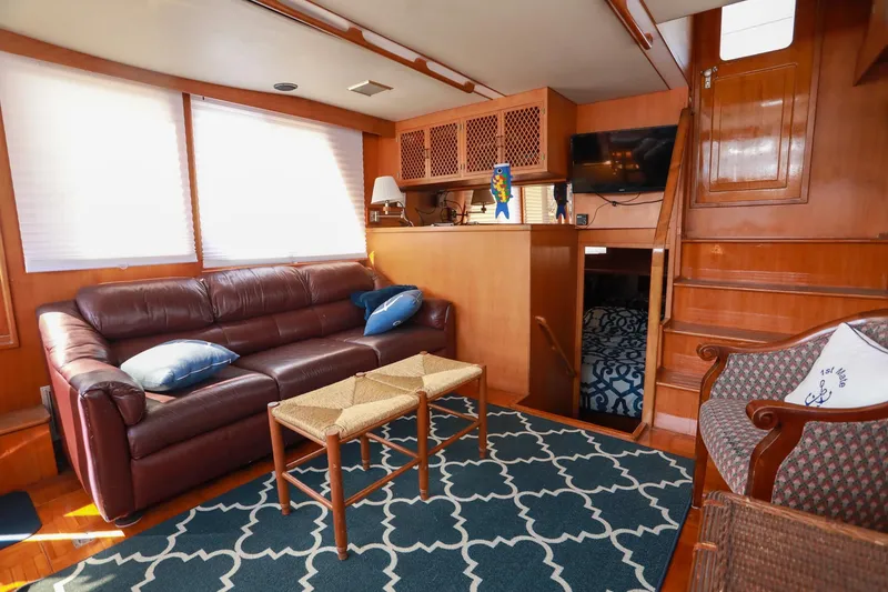 Slide: The Image of Luxurious interior of 1987 Lien Hwa 47 Elegant MK III yacht with leather sofa and nautical decor. - 15