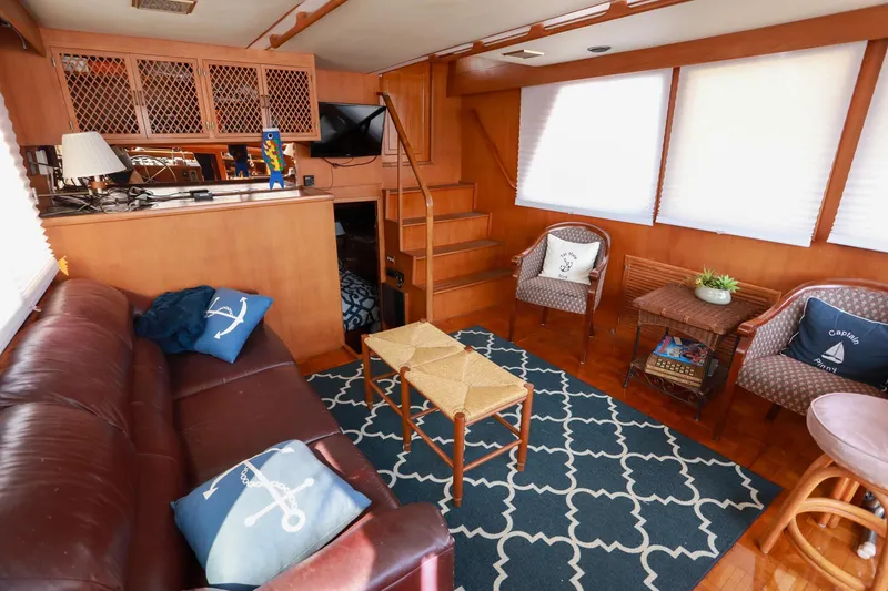 Slide: The Image of Interior of 1987 Lien Hwa 47 Elegant MK III yacht with cozy seating and nautical decor. - 16