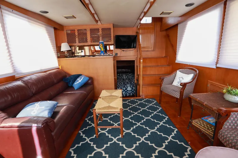 Slide: The Image of Luxurious interior of 1987 Lien Hwa 47 Elegant MK III yacht with cozy seating and decor. - 18