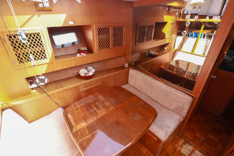 Slide: The Image of Interior of 1987 Lien Hwa 47 Elegant MK III yacht with wooden furnishings and cozy seating. - 20